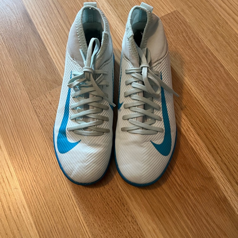 Nike Kid’s White and blue indoor soccer shoes